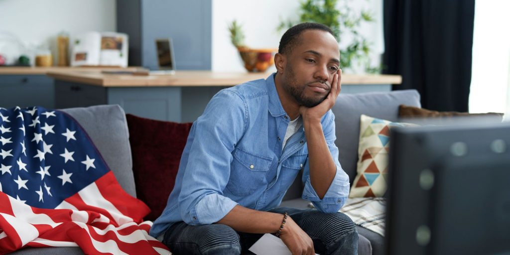 black man looking at tv