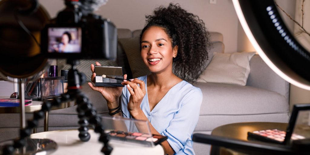 black woman making a video