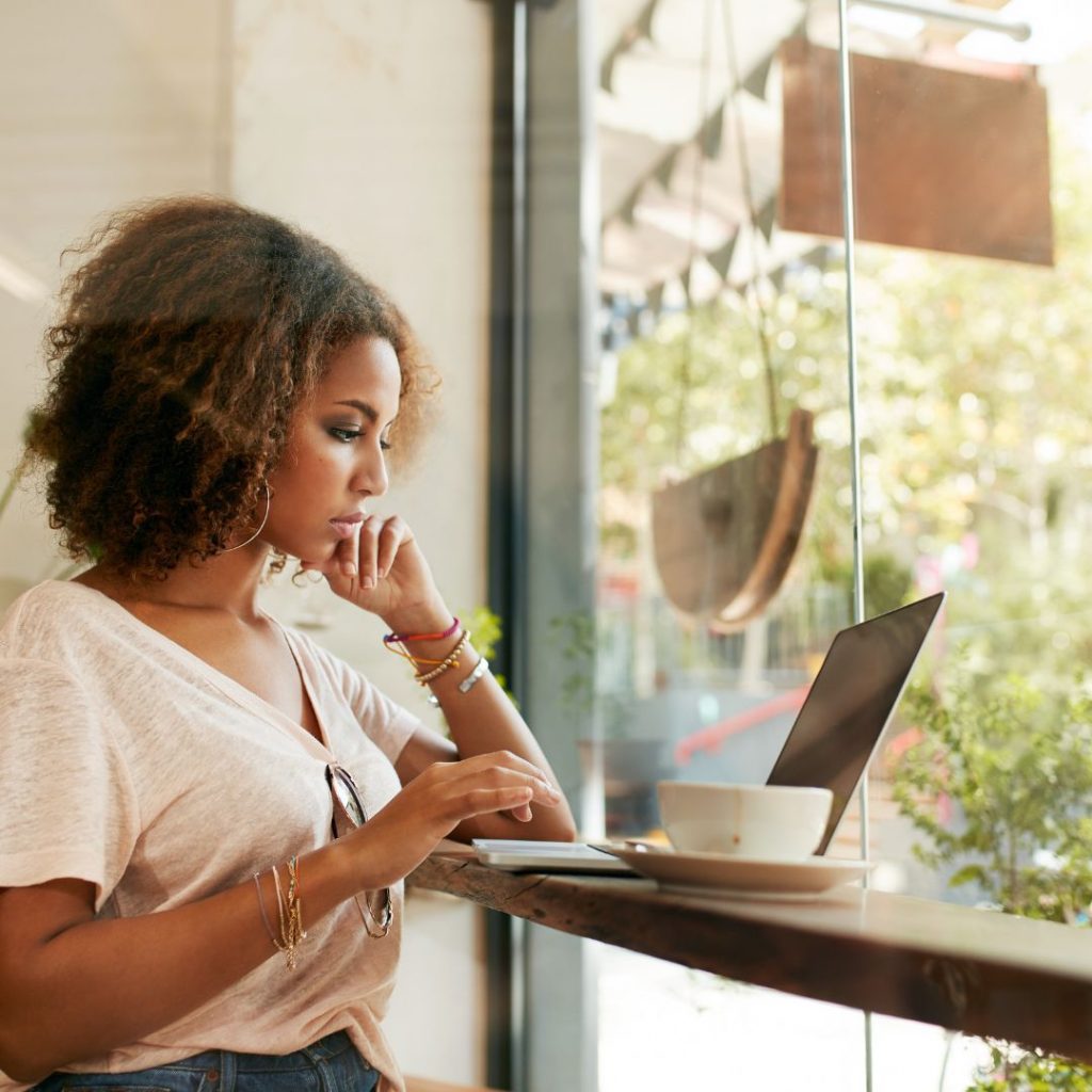 black woman working on laptop