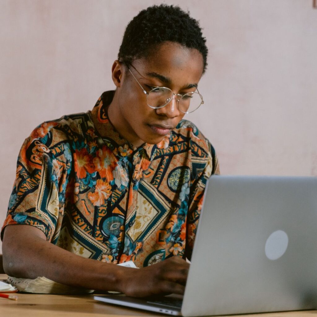 Navigating the Entertainment Industry: Tips for Black Content Creators 3 img of an African American man working on a computer