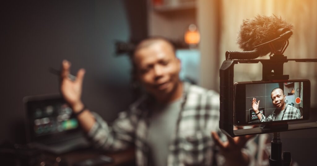 image of a man recording a video