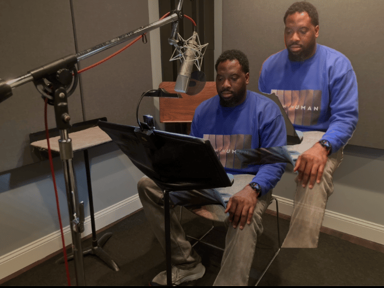 Kenny Radge records spoken-word vocals in the studio for Diary of a Traveler: Weapon of Choice Pen.